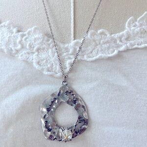 Silver tone medallion